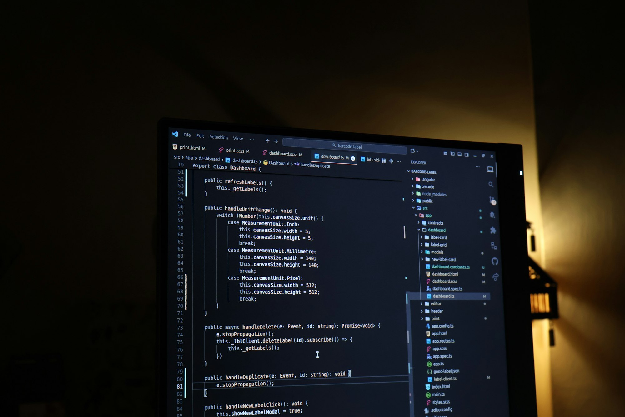 Source code on a monitor in a dim studio