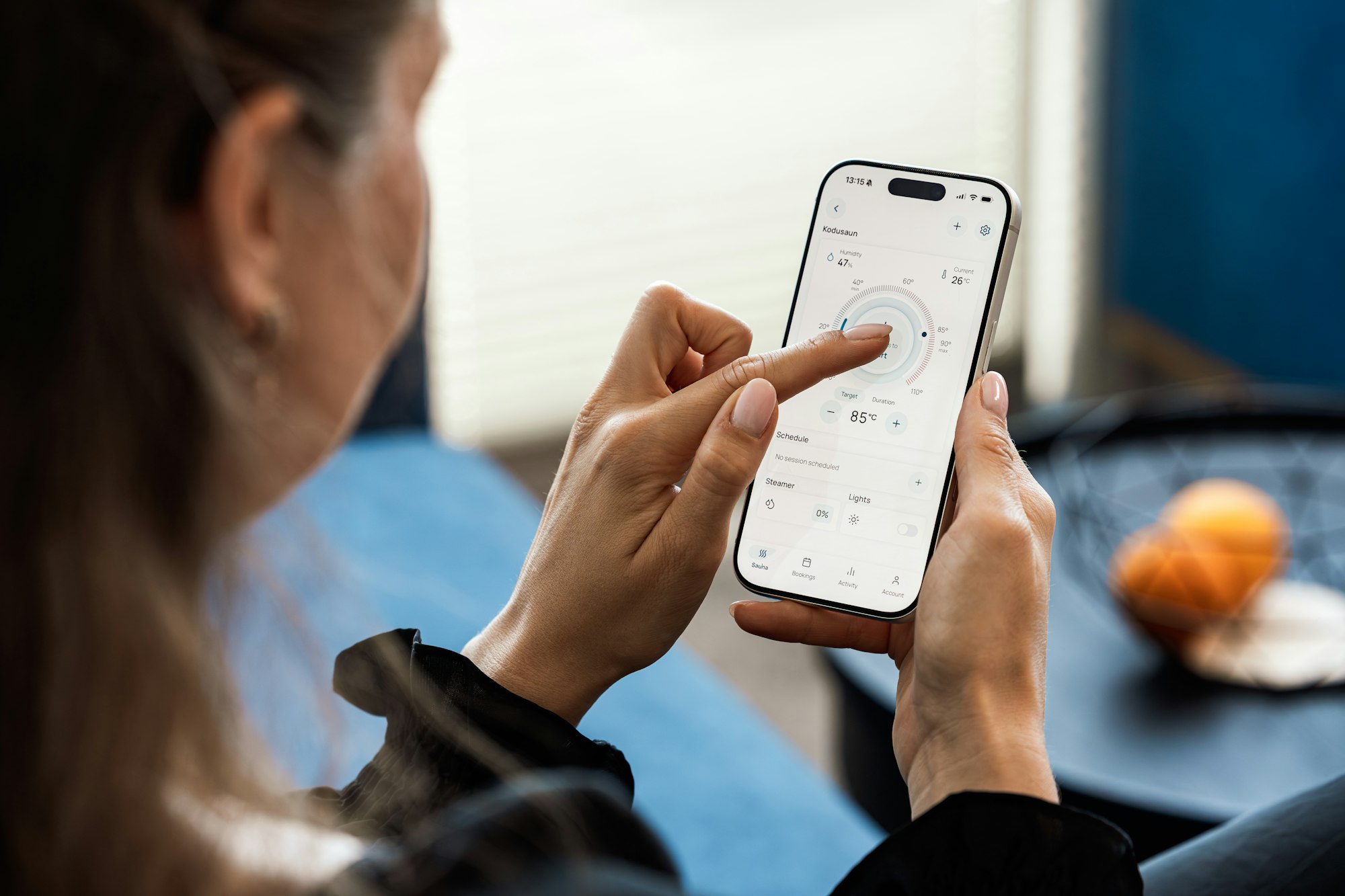 A person testing an app interface on a smartphone
