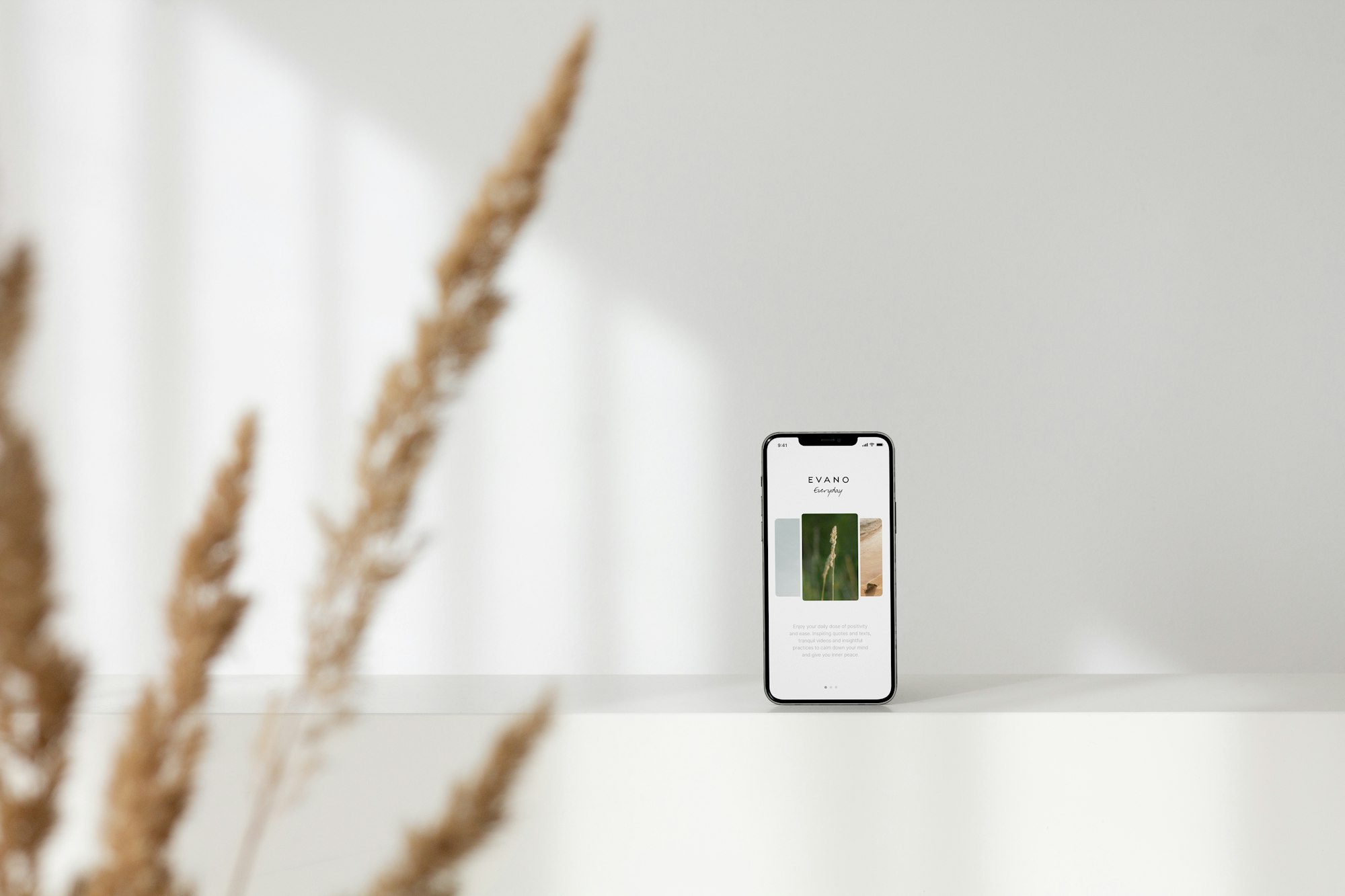 A smartphone standing on a clean white surface